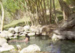 photo by Daud Saba - A satisfied young Afghan enjoys the traditional use of this known "shefa" hot spring that healed his skin condition (Aabe-Garm, Ghorband valley, province of Parwan, Afghanistan).